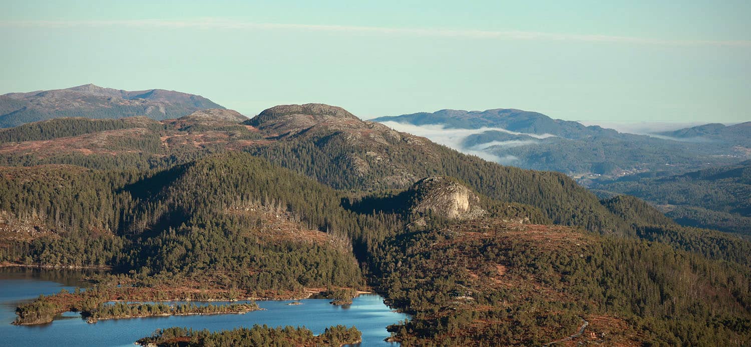 aeral view of forest clad hills in rissa, Norway